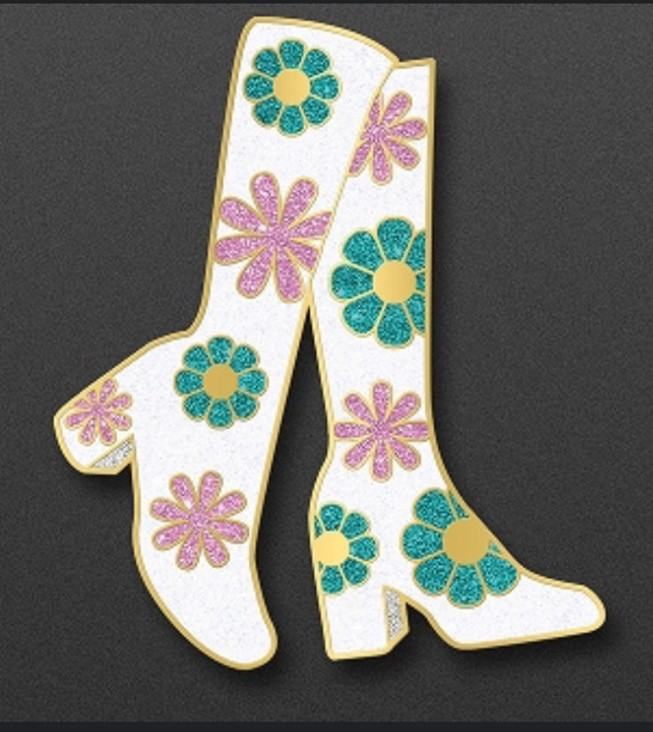 Decorative white boot with colorful flowers on a black background